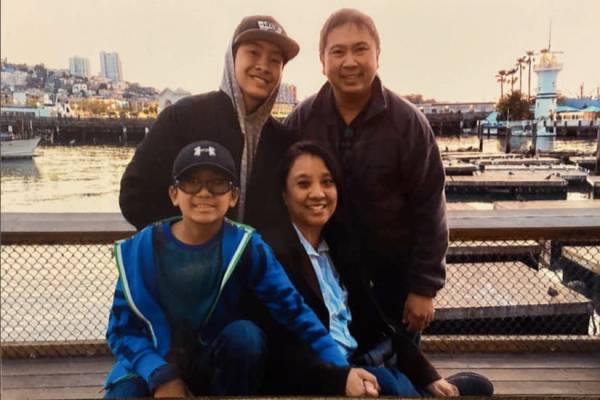 Filbert Aquino, wife Cynthia and sons Thomas, back row, and Timothy visit Fisherman's Wharf in ...