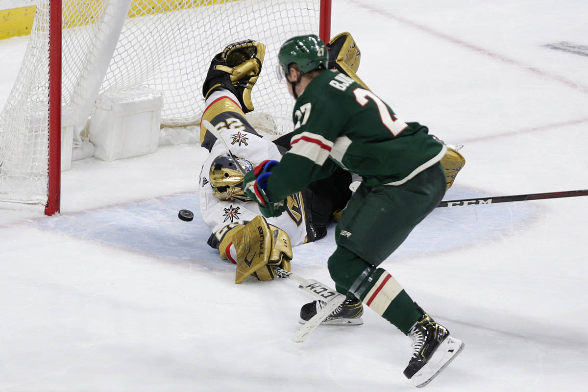 Minnesota Wild center Nick Bjugstad (27) scores a goal on Vegas Golden Knights goaltender Marc- ...