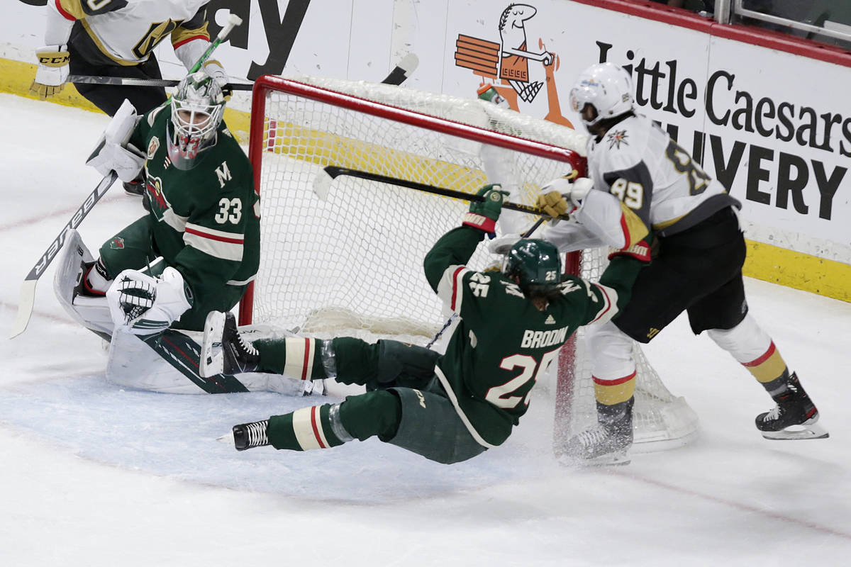 Minnesota Wild defenseman Jonas Brodin (25) is hit by Vegas Golden Knights right wing Alex Tuch ...