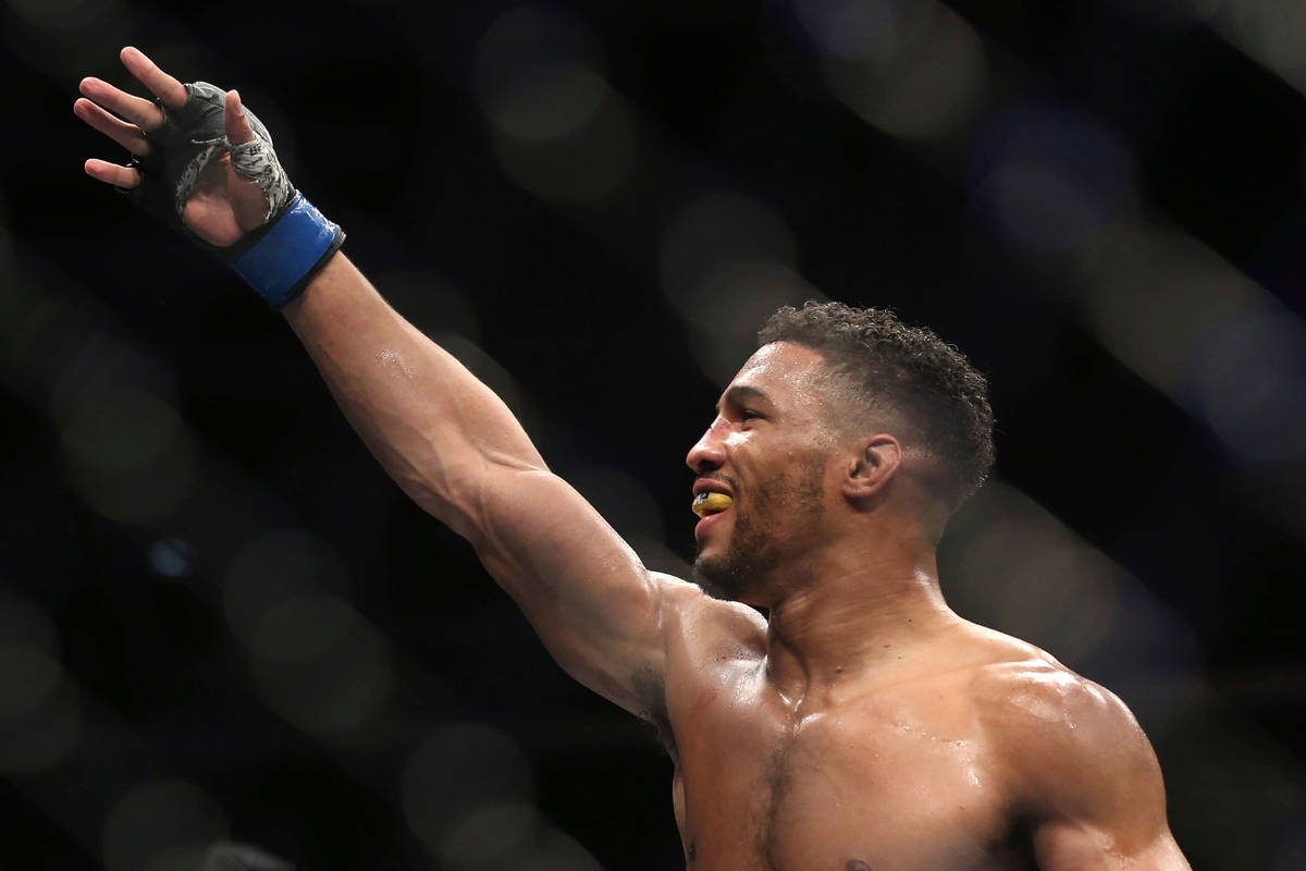 Kevin Lee celebrates his win over Edson Barboza after their fight was stopped in the fourth rou ...