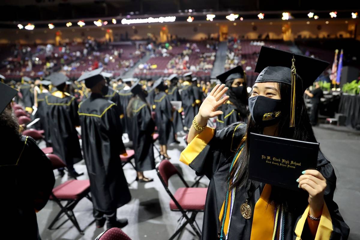 Clark High School graduate Sydney Lin waves to her family after a graduation ceremony at the Or ...