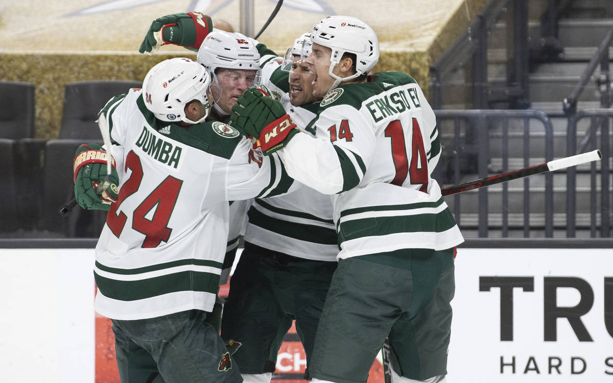 Minnesota Wild defenseman Matt Dumba (24) and Minnesota Wild center Joel Eriksson Ek (14) celeb ...