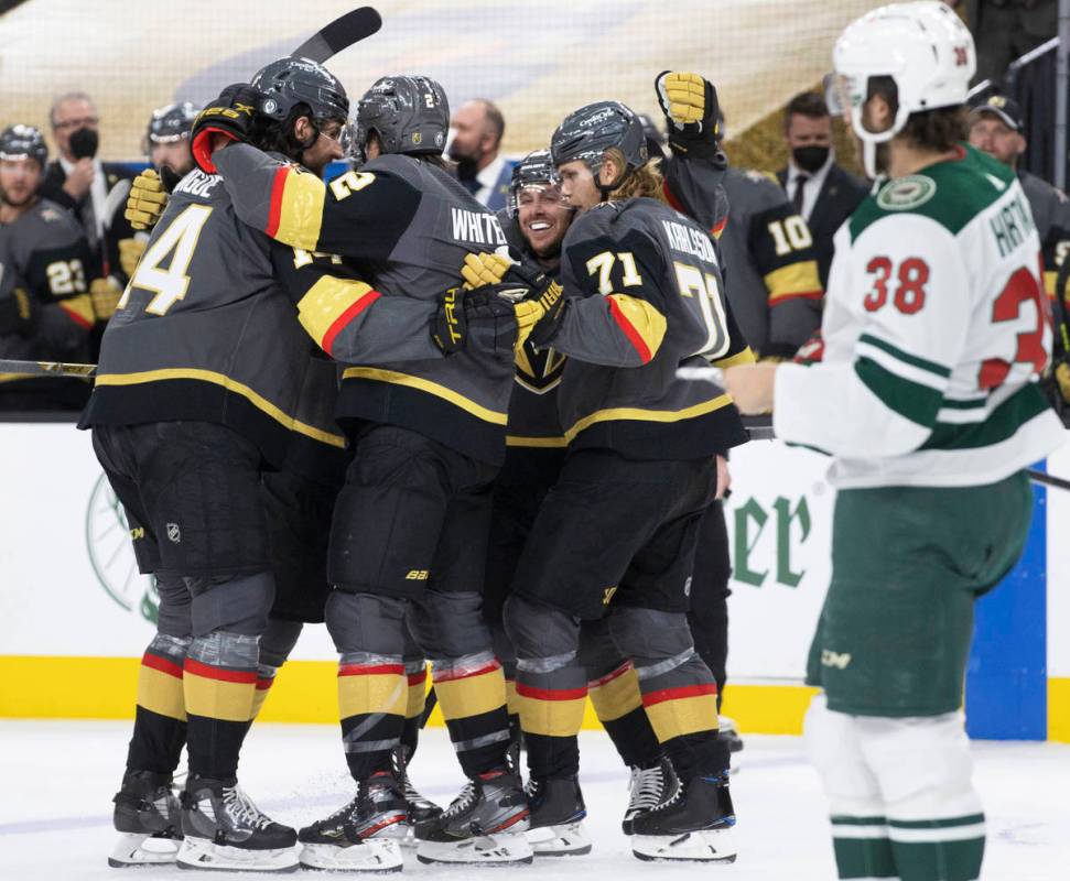 Vegas Golden Knights players celebrate after a second-period goal in game 7 of the an NHL Stanl ...