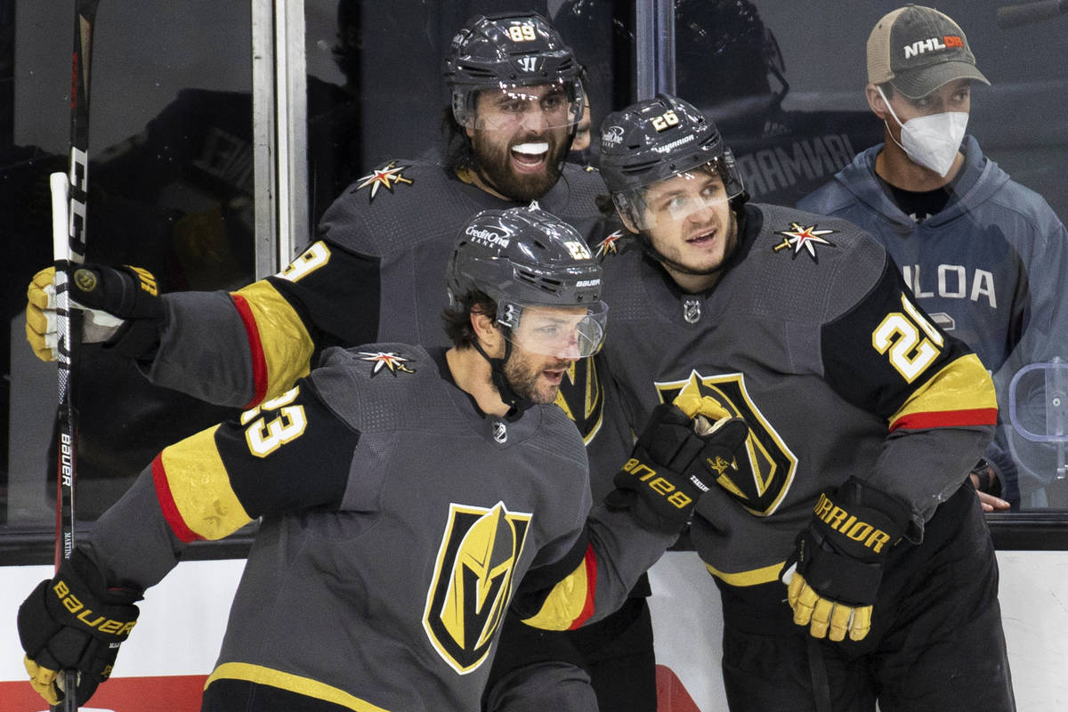 Vegas Golden Knights right wing Alex Tuch (89) and Vegas Golden Knights defenseman Alec Martine ...