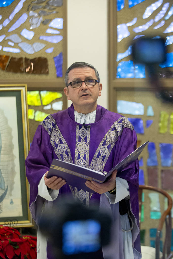 Cameras record Monsignor Gregory Gordon celebrating a virtual Mass at the the Roman Catholic Di ...