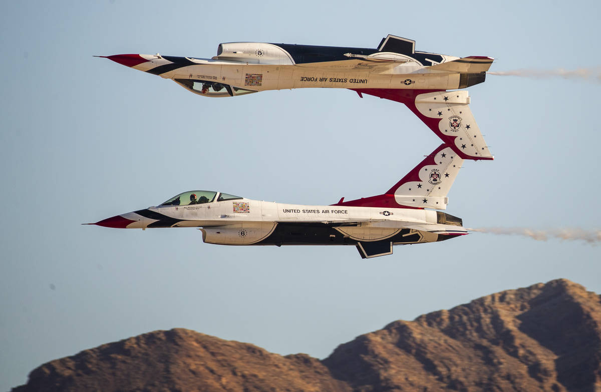 The U.S. Air Force Thunderbirds, with one inverted, in their performance during the Aviation Na ...
