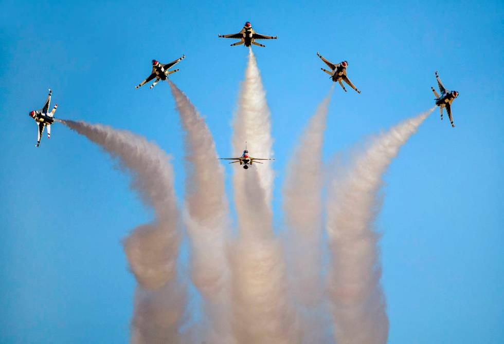 All six U.S. Air Force Thunderbirds break away from formation in various directions during the ...