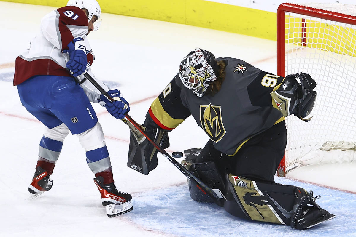 Golden Knights goaltender Robin Lehner (90) blocks the puck against Colorado Avalanche's Nazem ...