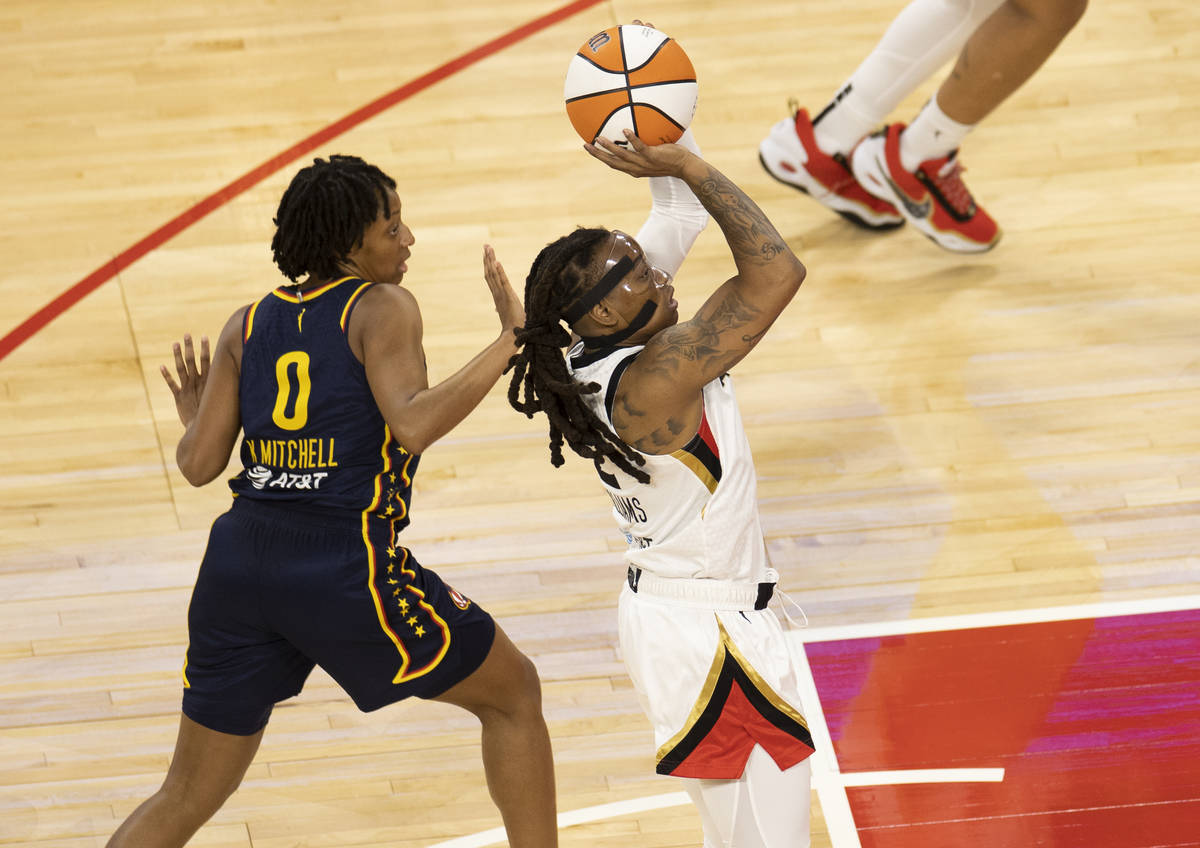 Las Vegas Aces guard Riquna Williams (2) shoots over Indiana Fever guard Kelsey Mitchell (0) in ...