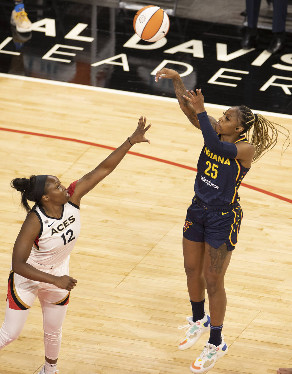 Las Vegas Aces guard Chelsea Gray (12) attempts to block the shot of Indiana Fever guard Tiffan ...