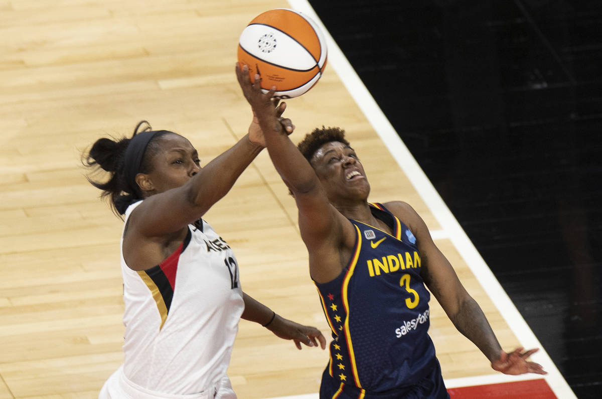 Indiana Fever guard Victoria Vivians (35) and Indiana Fever forward Teaira McCowan (15) fight f ...