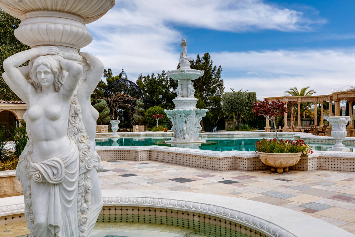 Statues and water features at 9409 Kings Gate Court in Las Vegas. (The Ivan Sher Group, Berkshi ...