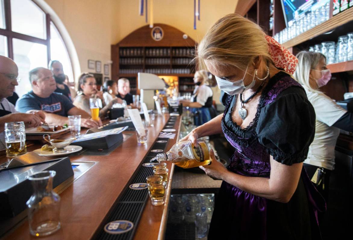 Shots are poured at the bar during the grand reopening of Hofbrauhaus Las Vegas on Tuesday, Jun ...