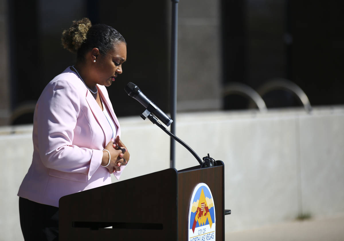 Elder Jurea Williams, of Sunrise Mountain Ministries, leads prayer during a flag-raising ceremo ...