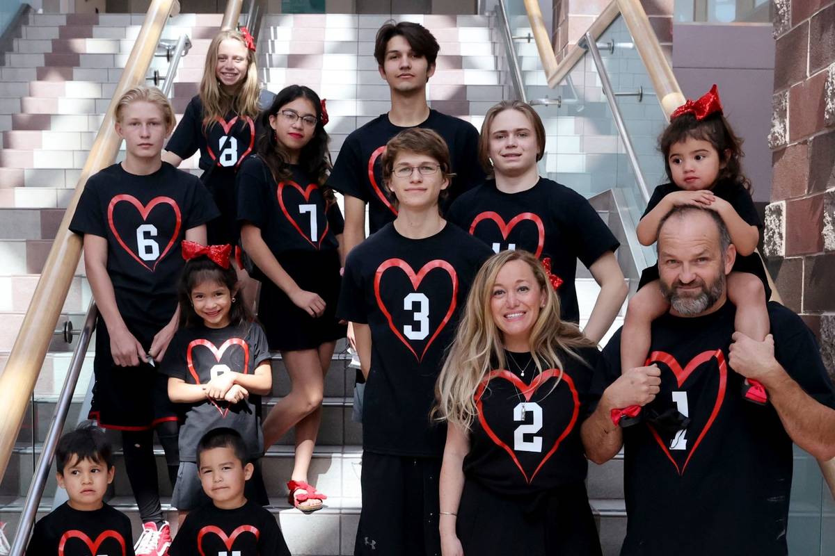 Heath and Aimee Hairr pose for pictures with their kids in Clark County Family Court in Las Veg ...