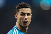 Juventus' Cristiano Ronaldo looks back during a Champions League Group D soccer match in Madrid ...