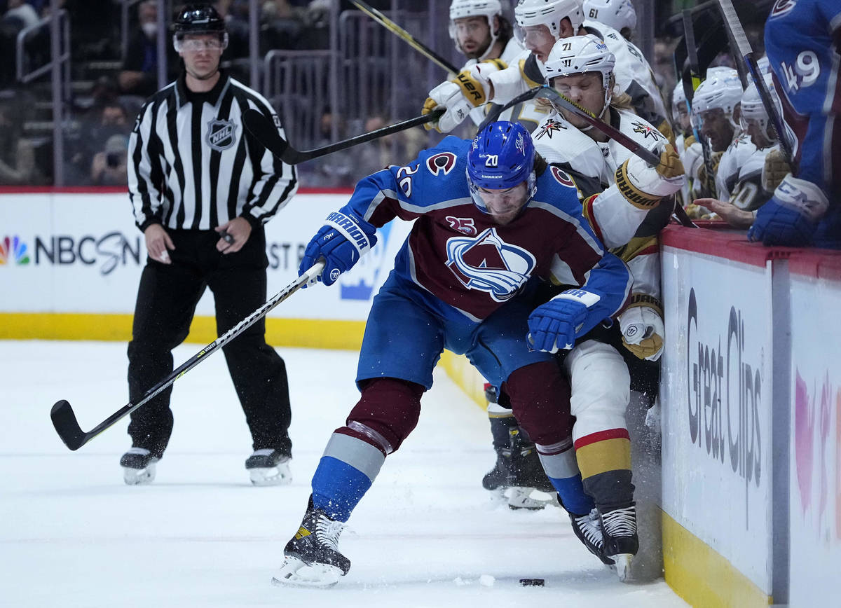 Colorado Avalanche left wing Brandon Saad (20) checks Vegas Golden Knights center William Karls ...