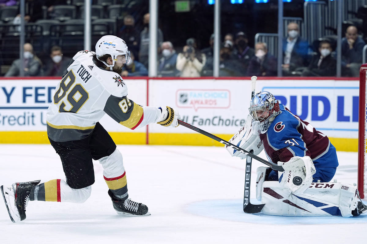 Colorado Avalanche goaltender Philipp Grubauer (31) blocks a shot by Vegas Golden Knights right ...