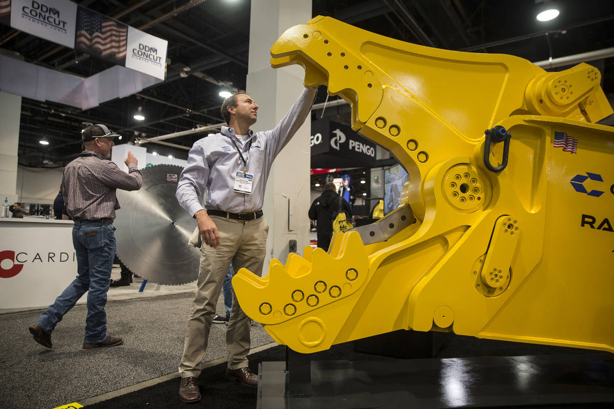 Jon Fodor, with Genesis Attachments, looks over a Genesis Razer heavy electric breaker during d ...