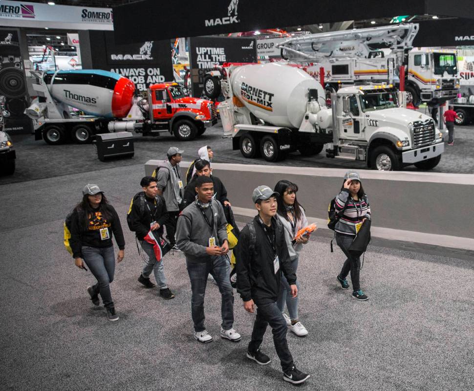 Convention goers explore the Central Hall during the last day of World of Concrete on Friday, J ...