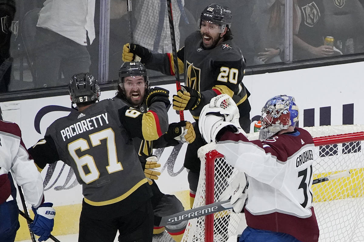 Vegas Golden Knights center Chandler Stephenson (20) and Vegas Golden Knights right wing Mark S ...