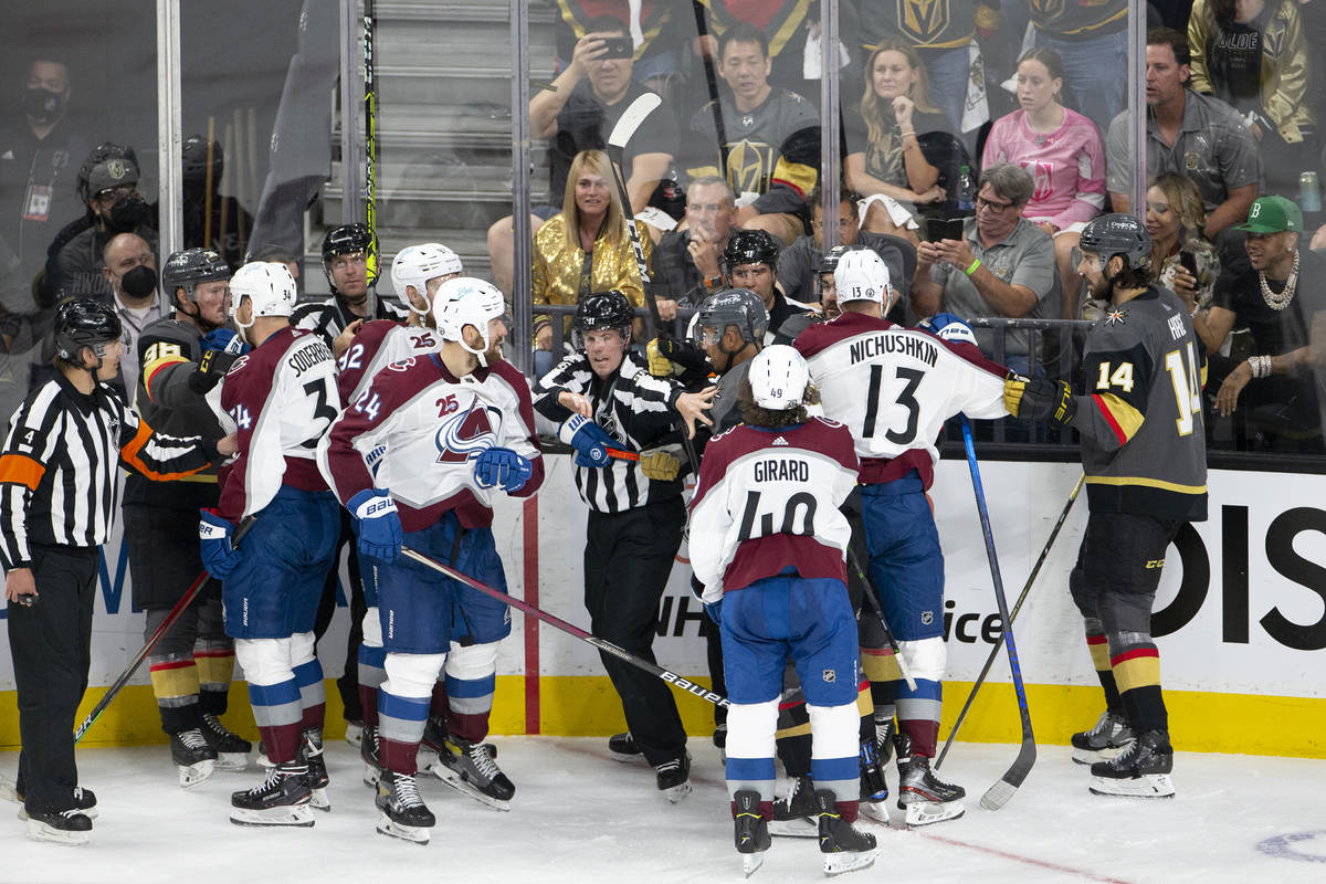 A referee breaks up a conflict between Golden Knights right wing Keegan Kolesar (55) and Avalan ...