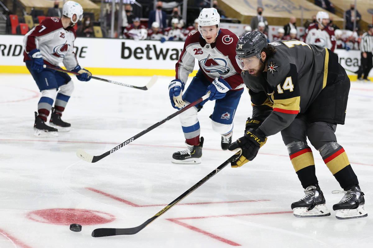 Colorado Avalanche defenseman Cale Makar (8) defends against Vegas Golden Knights defenseman Ni ...