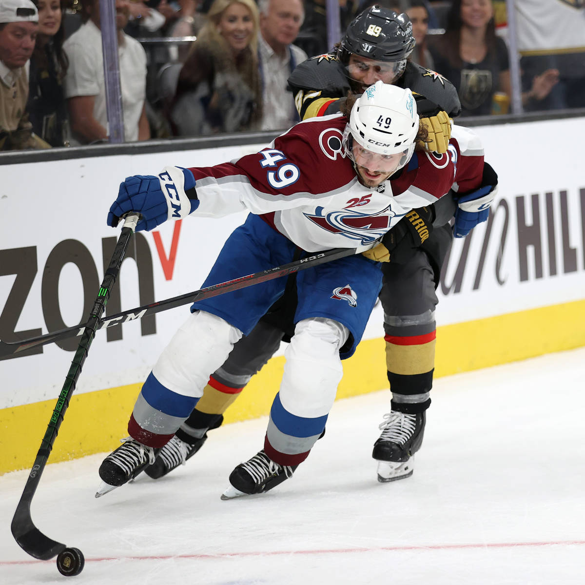 Colorado Avalanche defenseman Samuel Girard (49) defends against Vegas Golden Knights right win ...