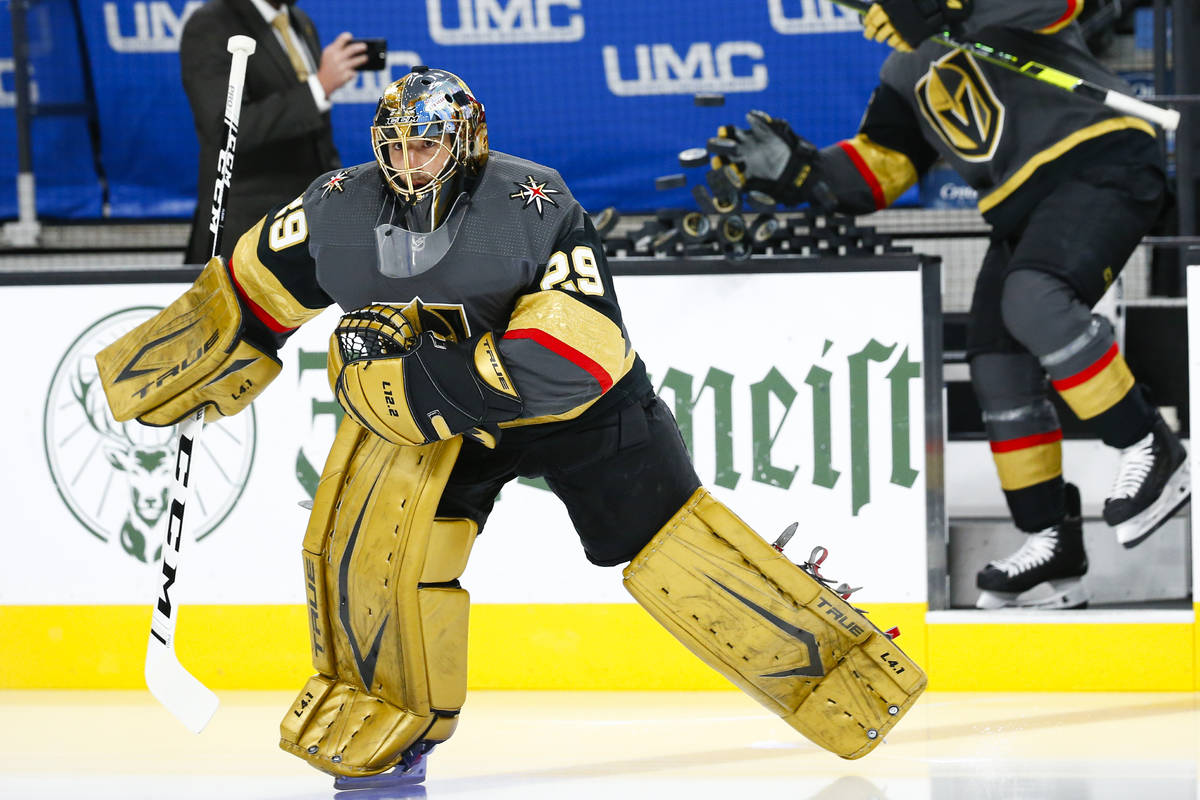 Golden Knights goaltender Marc-Andre Fleury warms up before the start of Game 5 of a first-roun ...