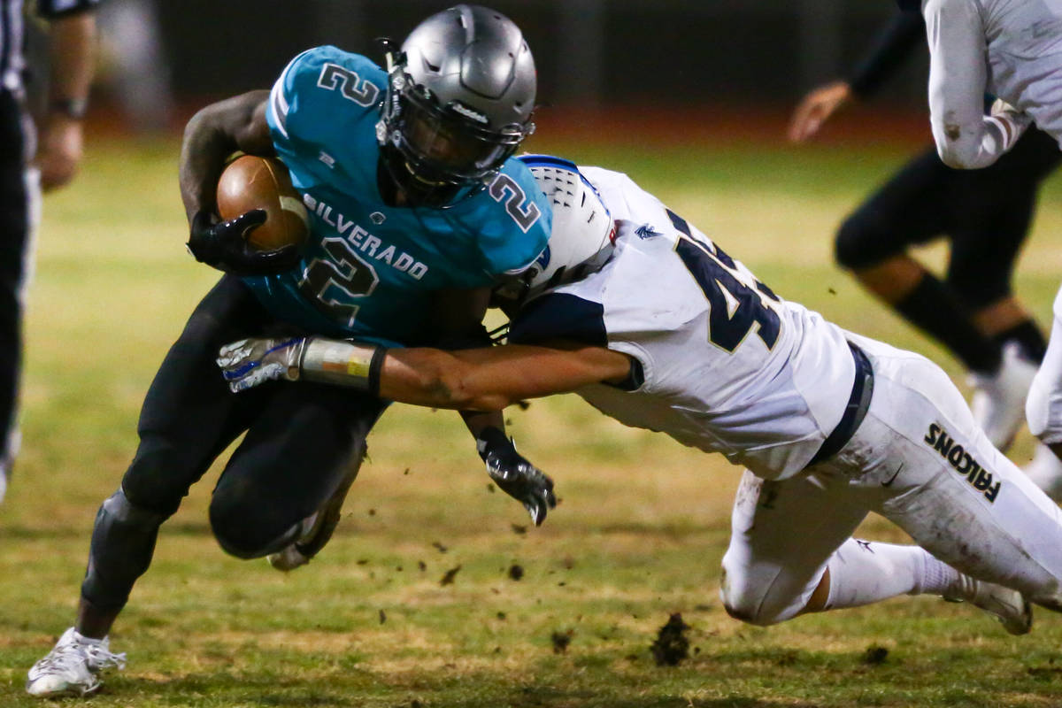 Foothill's Colter Mckee (45) stops Silverado's Aginae Cunningham (2) during the second half of ...