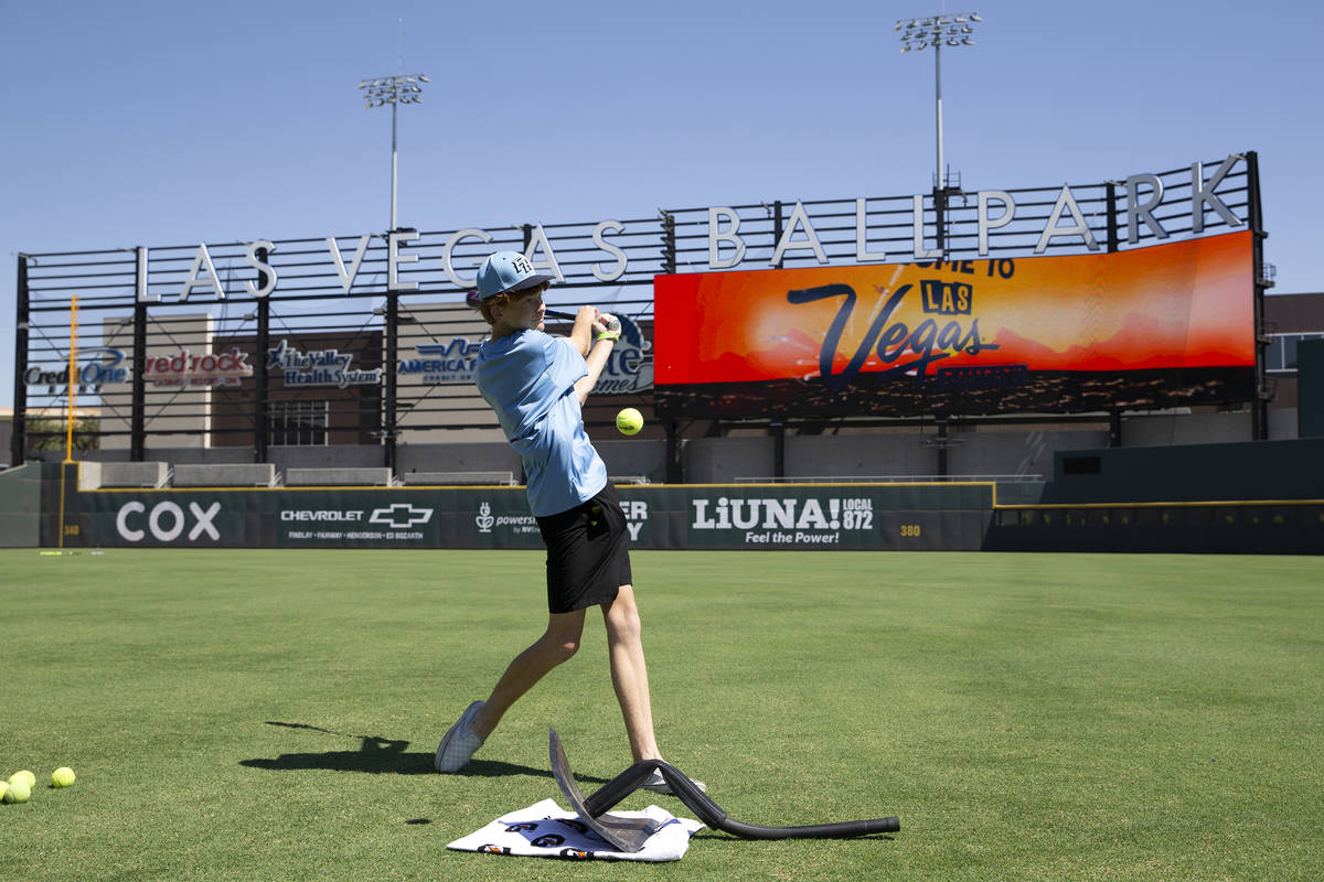 Ian Gross, 15, volunteers during a free COVID-19 vaccination clinic at Las Vegas Ballpark on Sa ...