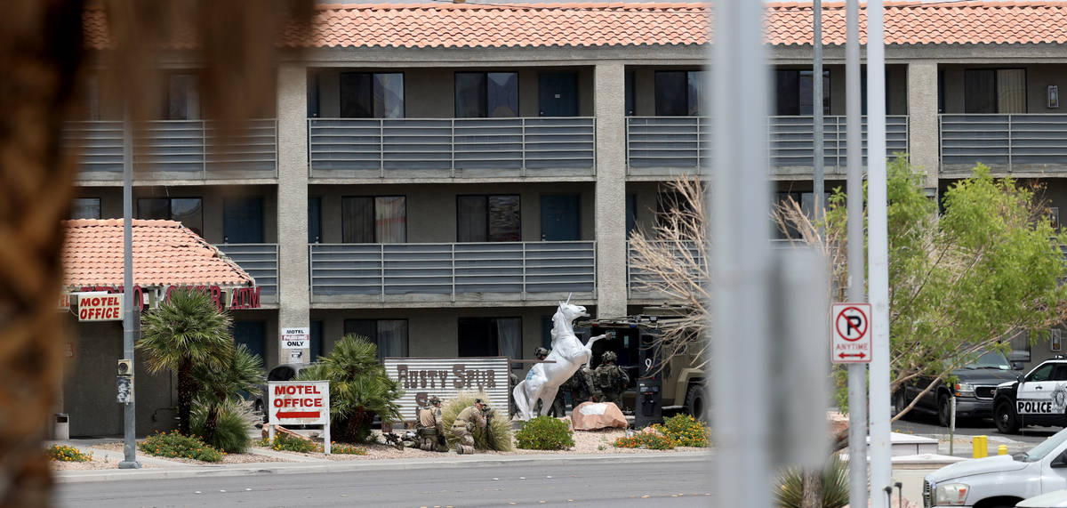 Las Vegas police work a barricade situation at the Highland Inn Motel on Dean Martin Drive nort ...