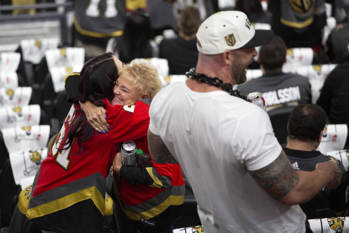 Golden Knights fans embrace before Game 3 of a second-round NHL hockey Standley Cup playoff ser ...