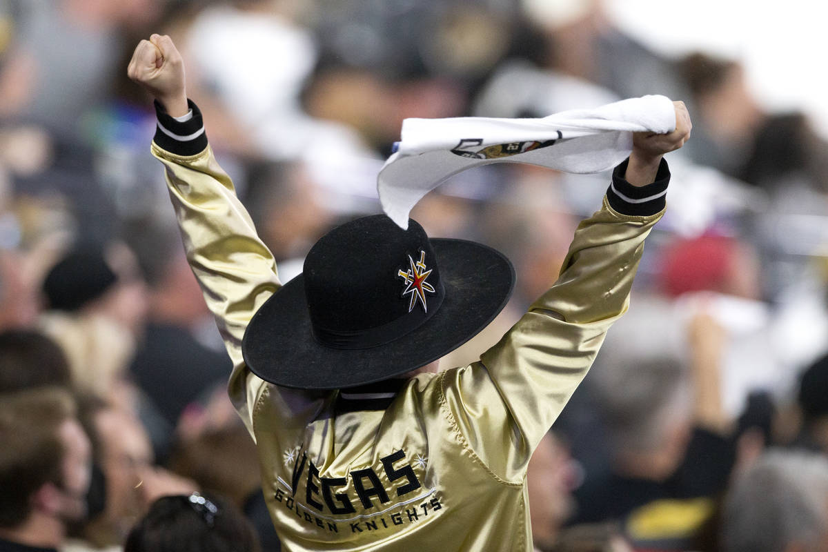 A Golden Knights fan cheers during the first period of Game 3 of a second-round NHL hockey Stan ...