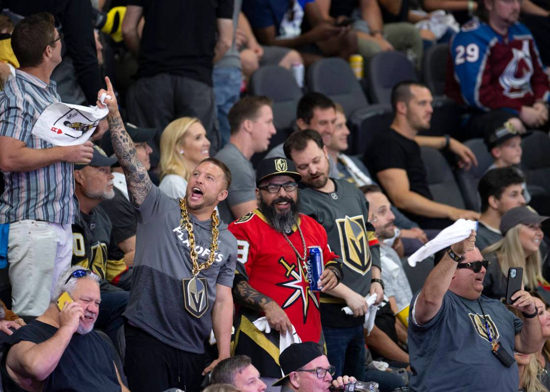 Fans cheer after the Golden Knights take the lead in the third period of Game 3 of a second-rou ...