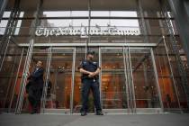 FILE - In this June 28, 2018, file photo, a police officer stands outside The New York Times bu ...