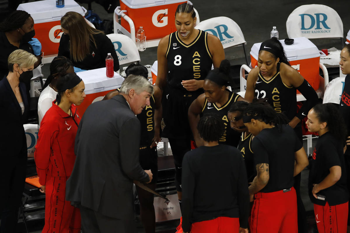 Las Vegas Aces players get together withLas Vegas Aces head coach Bill Laimbeer, center, before ...