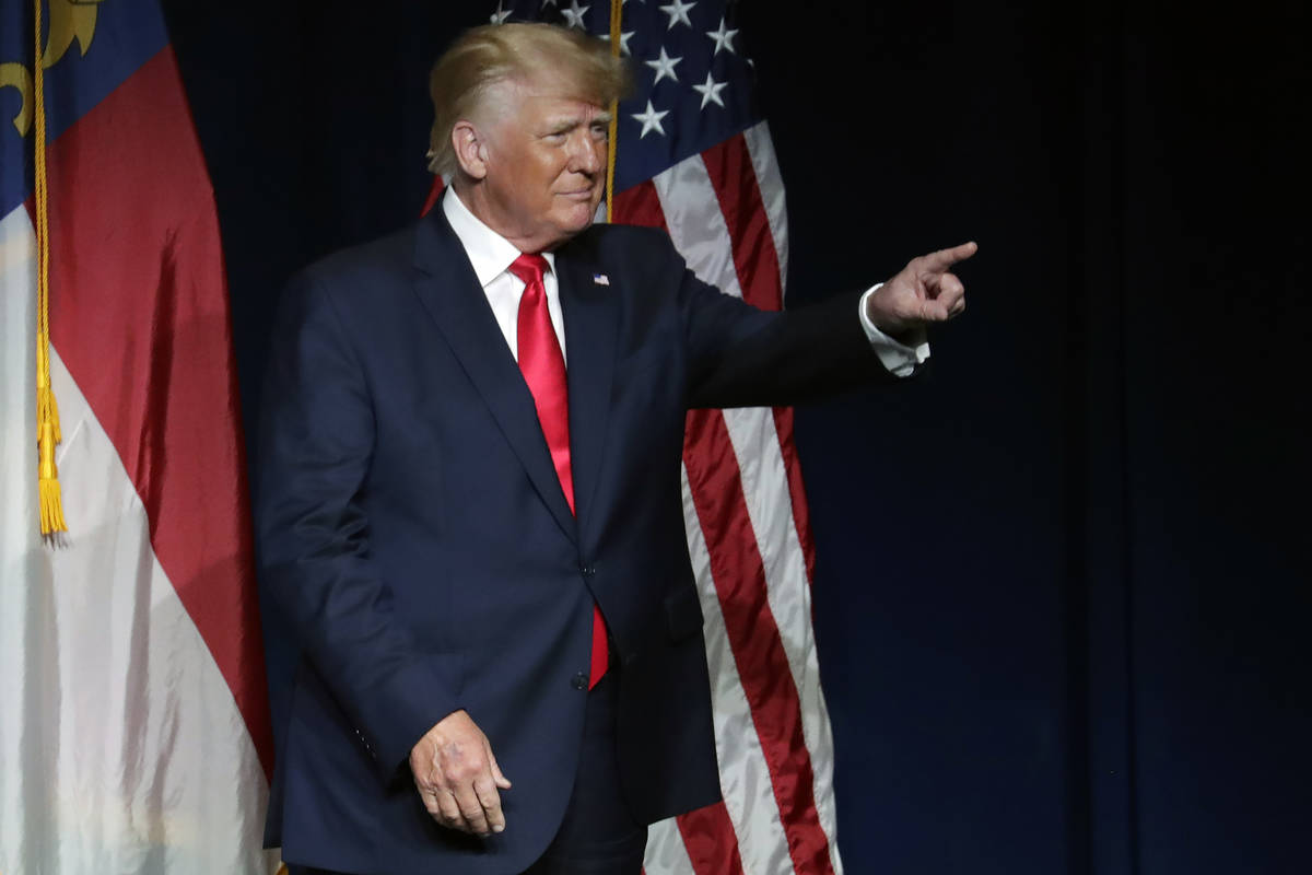 Former President Donald Trump acknowledges the crowd as he speaks at the North Carolina Republi ...