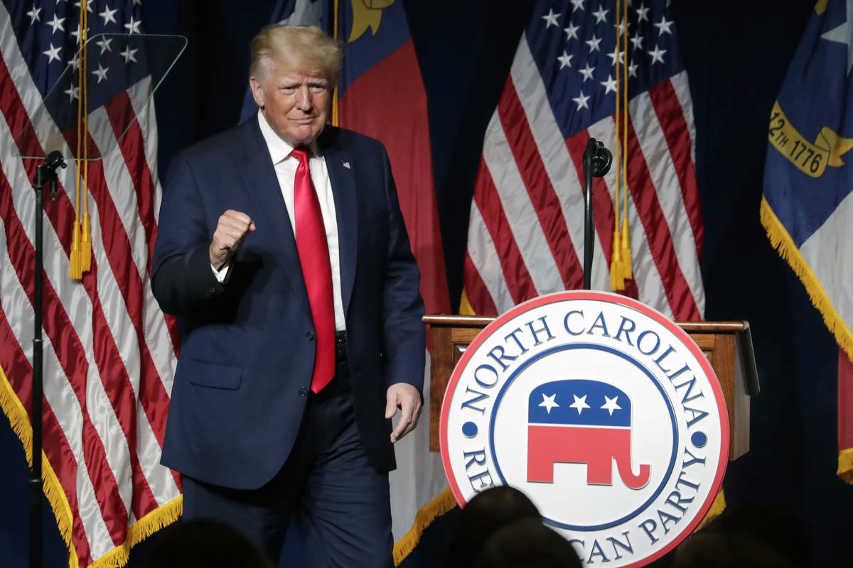 Former President Donald Trump acknowledges the crowd as he speaks at the North Carolina Republi ...