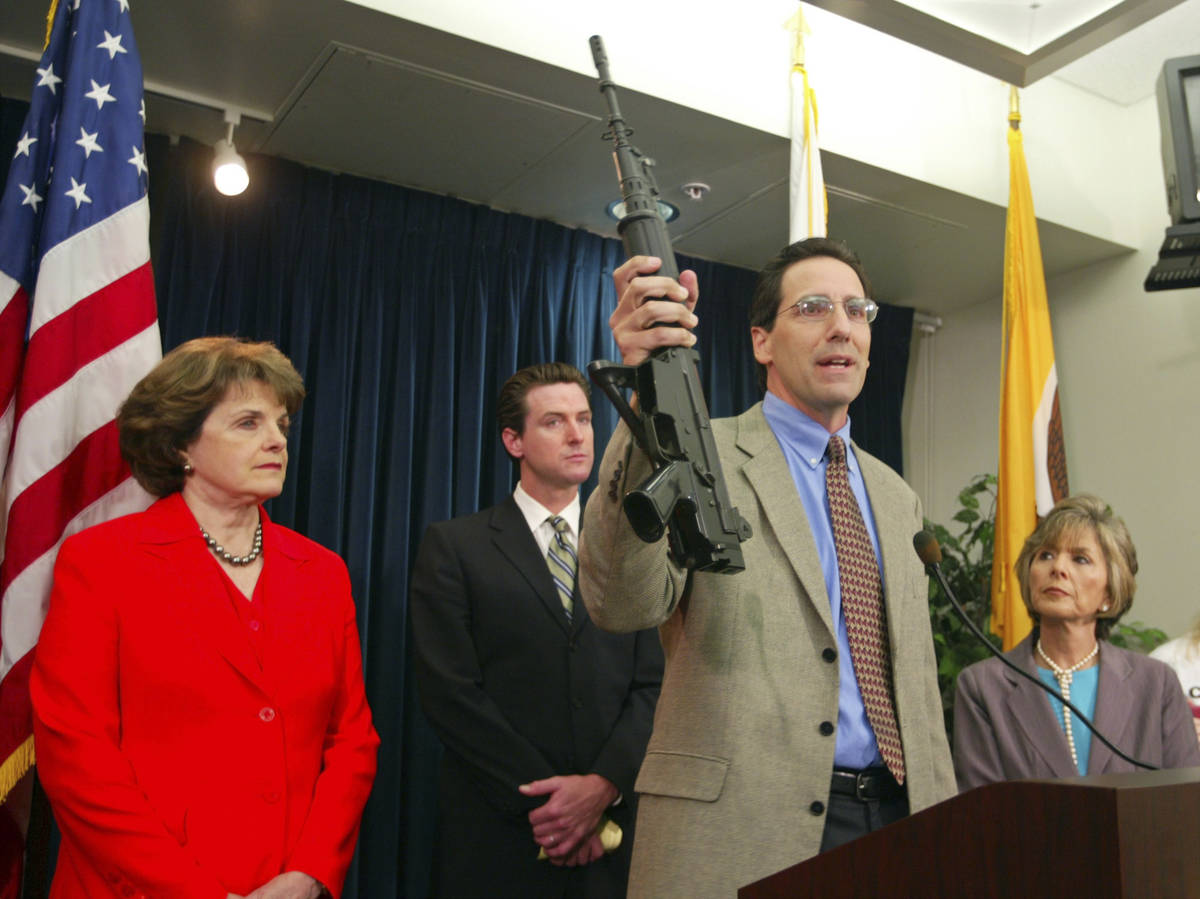 In this June 29, 2004, file photo, Steve Sposato, who lost his wife in a shooting, holds an aut ...