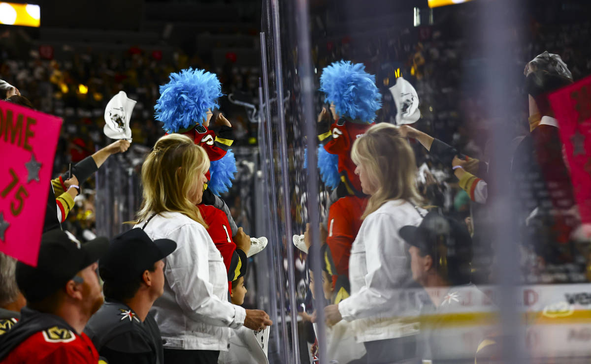 Golden Knights fans cheer as players warm up before Game 4 of an NHL hockey Stanley Cup second- ...