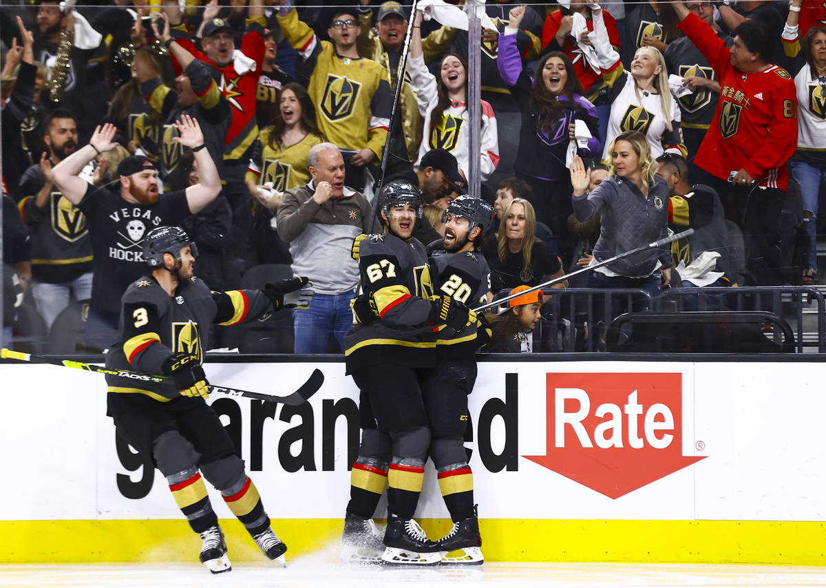 Golden KnightsÕ Max Pacioretty (67) celebrates his goal with Brayden McNabb (3) and Chandl ...