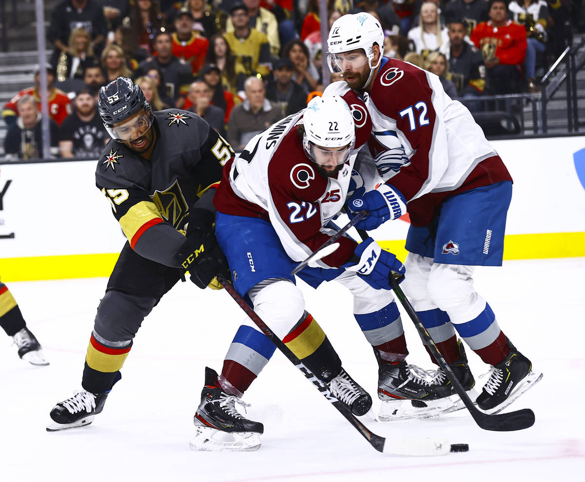 Golden Knights' Keegan Kolesar (55) battles for the puck against Colorado Avalanche's Conor Tim ...