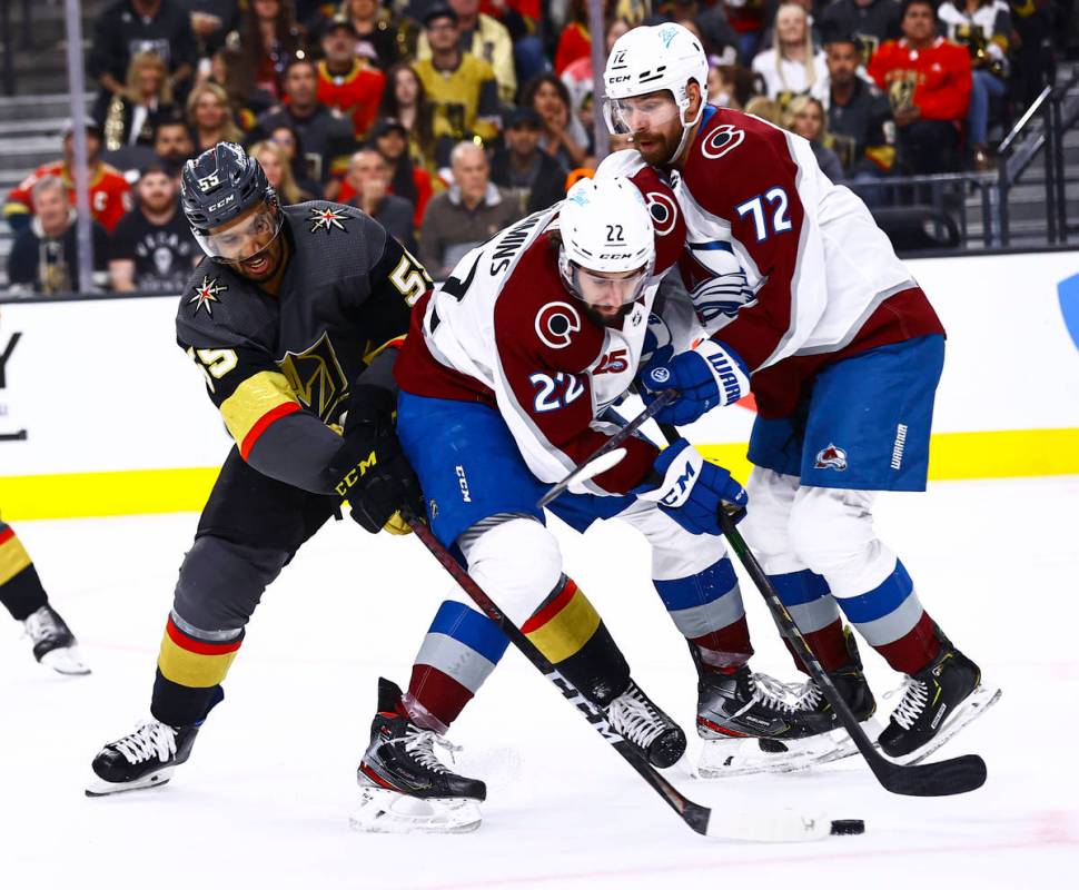 Golden Knights' Keegan Kolesar (55) battles for the puck against Colorado Avalanche's Conor Tim ...