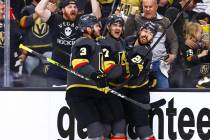 The Golden Knights' Max Pacioretty (67) celebrates his goal with Brayden McNabb (3) and Chandle ...