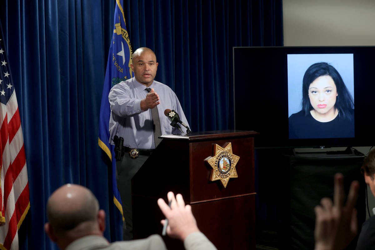 Las Vegas police homicide Lt. Ray Spencer shows a photo during a news conference at Metropolita ...