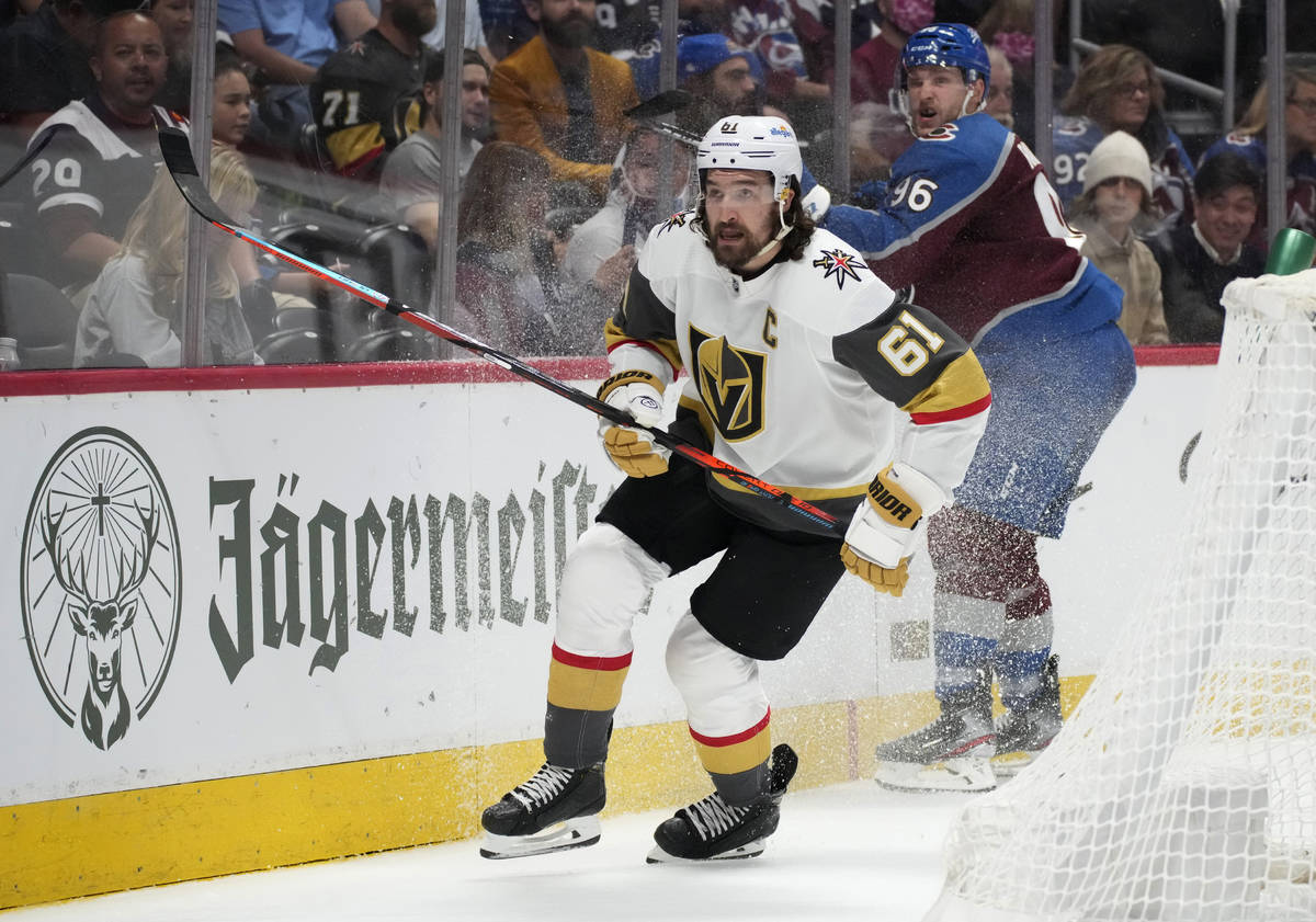 Vegas Golden Knights right wing Mark Stone, front, pursues the puck after checking Colorado Ava ...