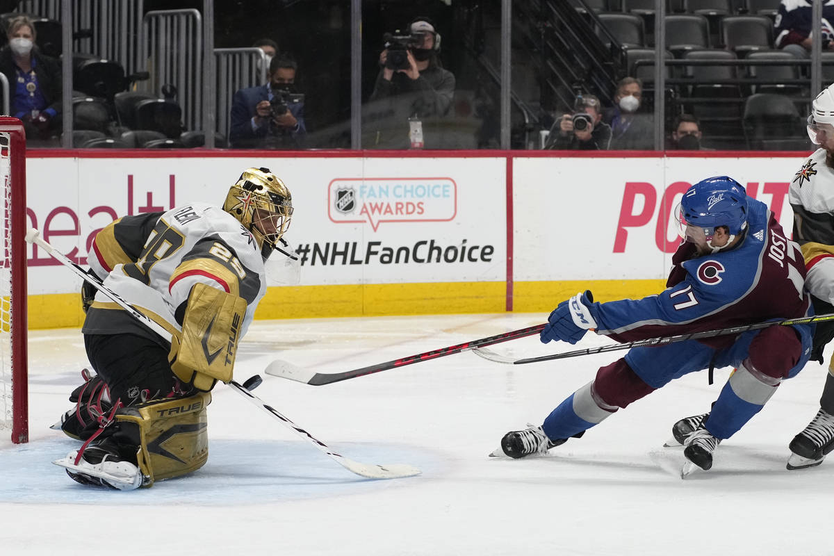 Colorado Avalanche center Tyson Jost puts a shot on Golden Knights goaltender Marc-Andre Fleury ...