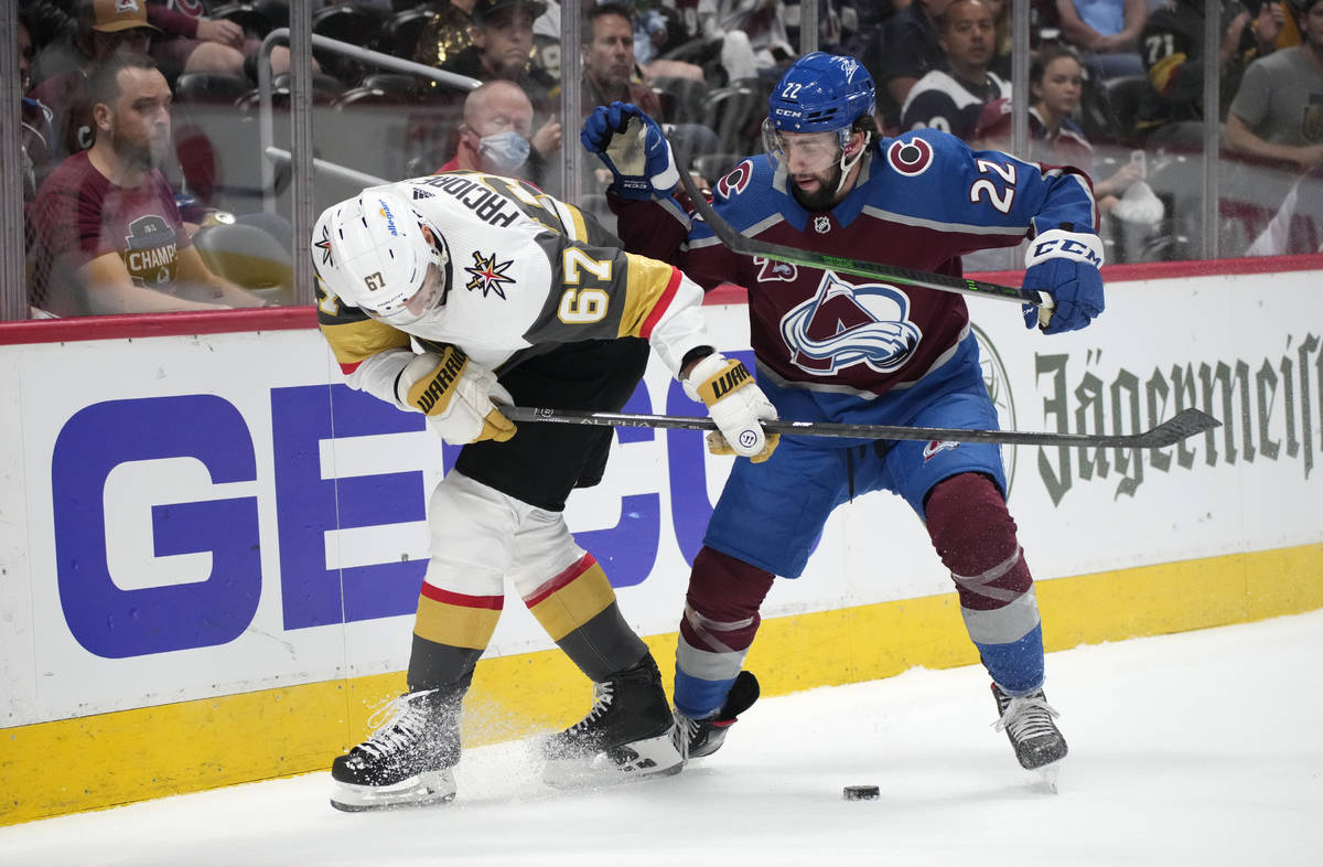 Vegas Golden Knights left wing Max Pacioretty, left, fights for control of the puck with Colora ...