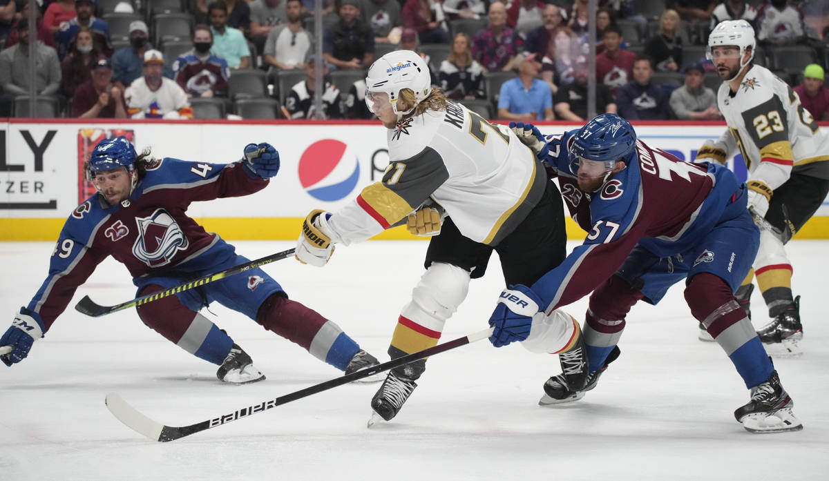 Vegas Golden Knights center William Karlsson, center, drives between Colorado Avalanche defense ...